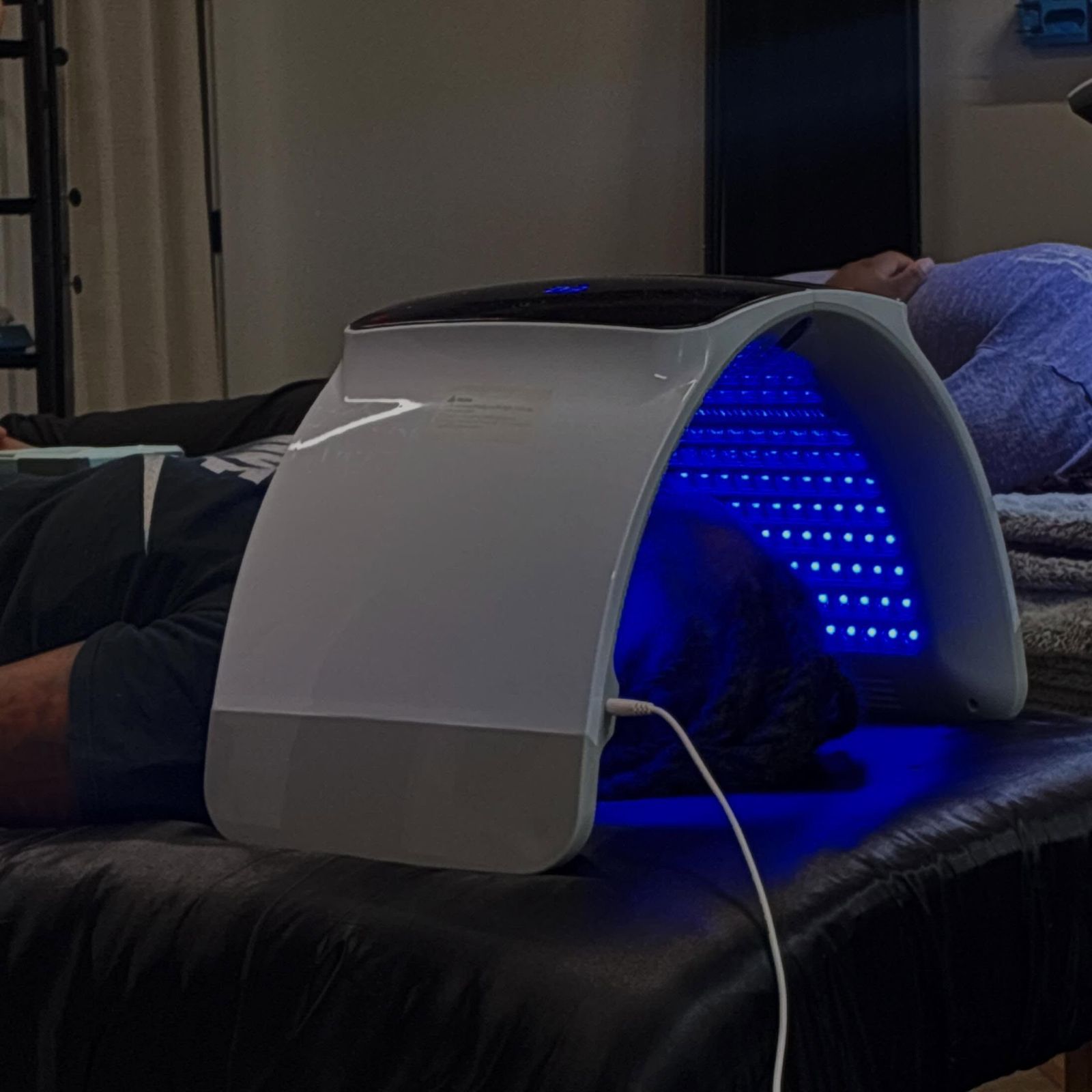 LED light therapy panel during a facial