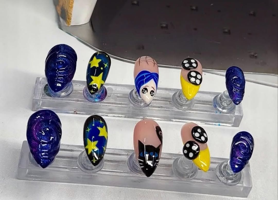 Character nail art tips on a display stand