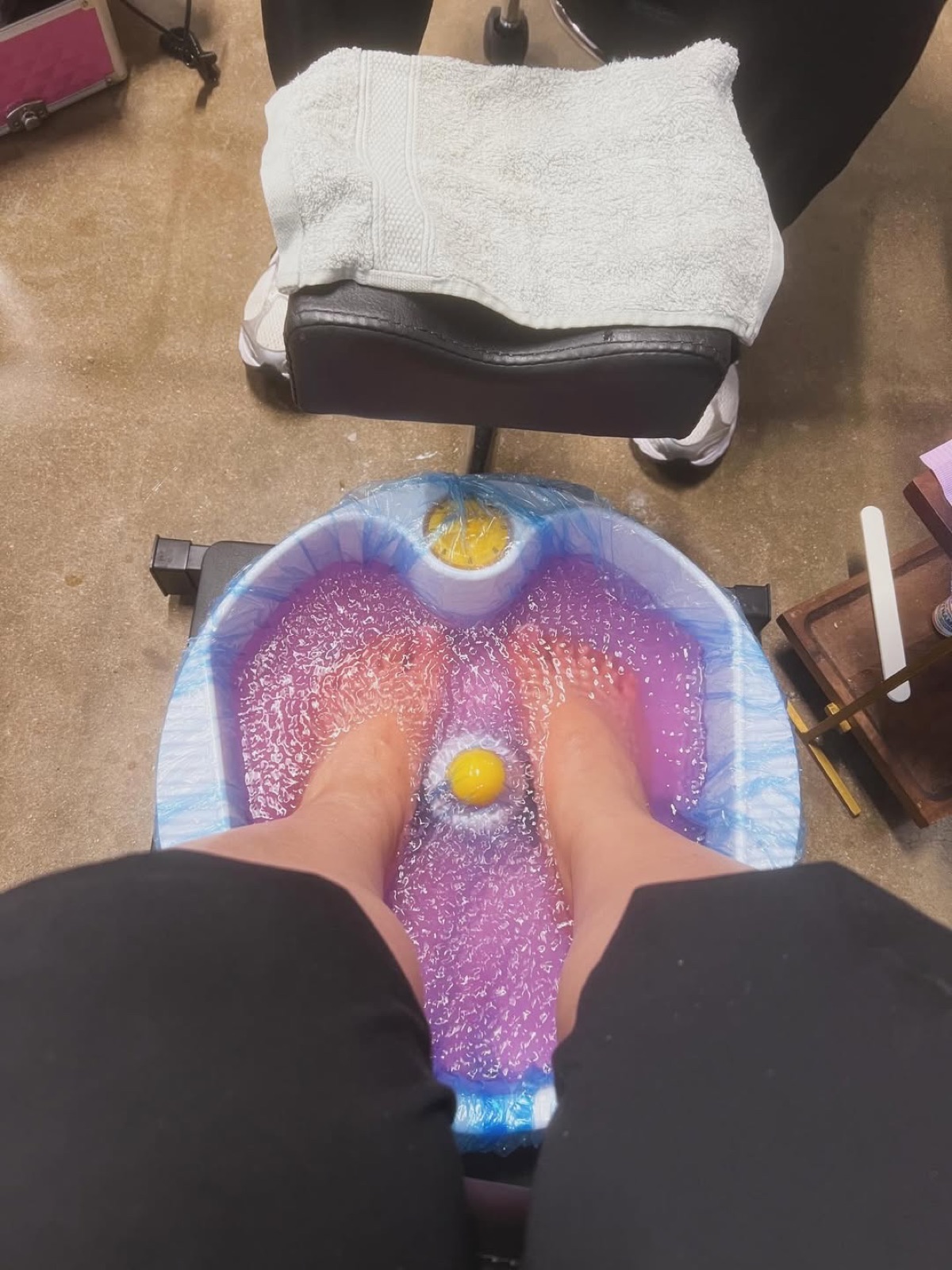 Pedicure bowl filled with bubbling lavender water, ready for a pedicure